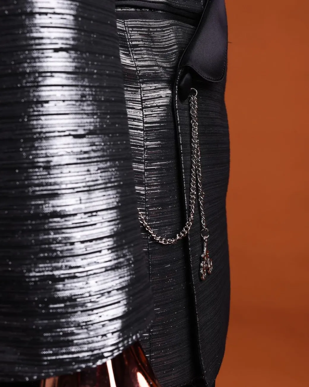 A wire metallic silver and black jacquard, lower cut, wrap shawl lapel tuxedo suit