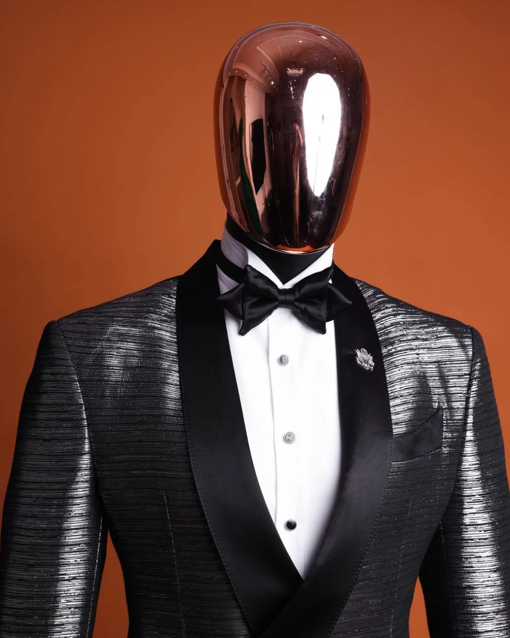 A wire metallic silver and black jacquard, lower cut, wrap shawl lapel tuxedo suit