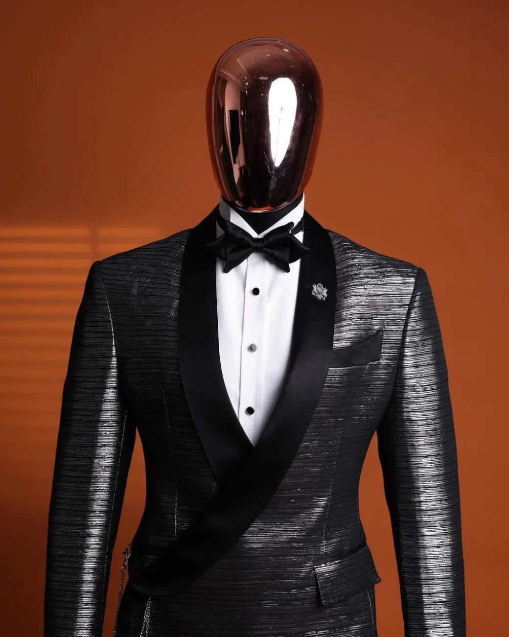 A wire metallic silver and black jacquard, lower cut, wrap shawl lapel tuxedo suit