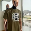 A Wood brown, 4-quadrant paisley foundation with crown skull embroidery punk biker patch detailing African traditional senator Kaftan native.