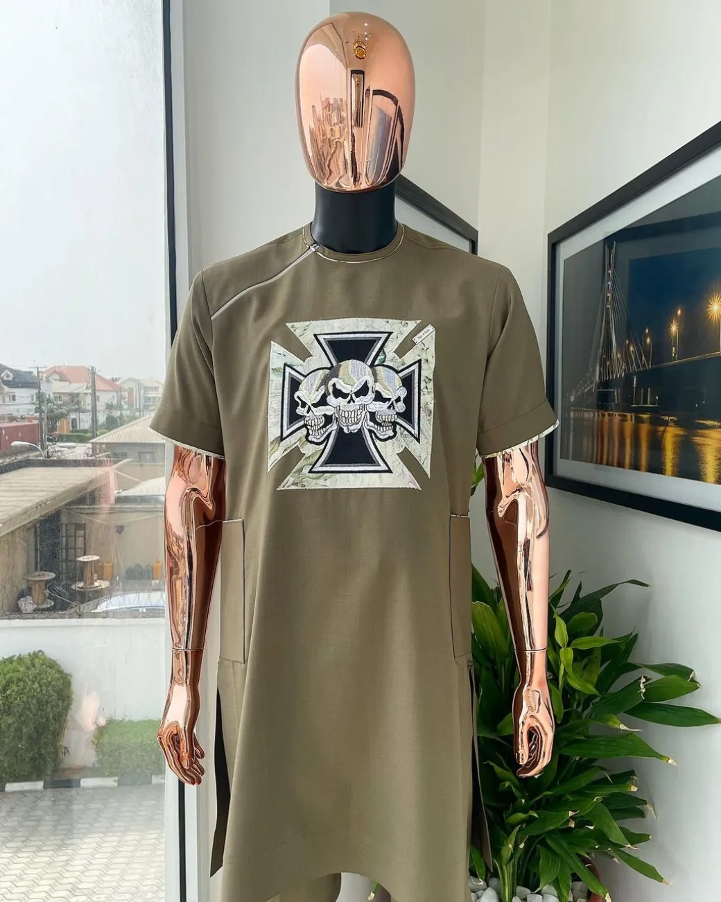 A Wood brown, 4-quadrant paisley foundation with crown skull embroidery punk biker patch detailing African traditional senator Kaftan native.