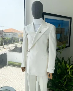 A wrap and strapped ivory white, peak lapel suit