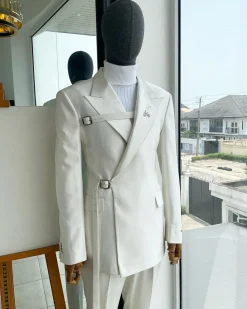 A wrap and strapped ivory white, peak lapel suit
