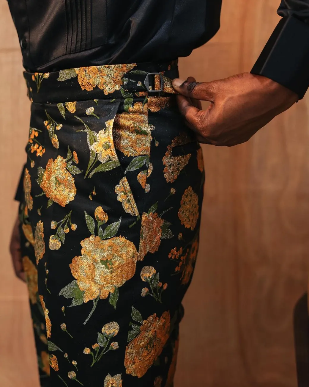 A yellow, silk black jacquard pants with a splash of gold print.