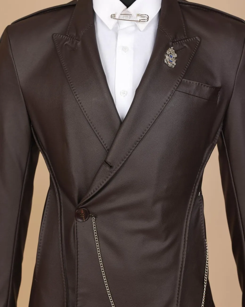 A #Herd” brown leather, knitted & outer layered peak lapel wrap suit