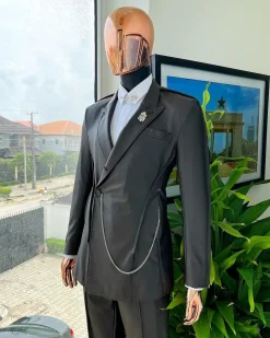A #Herd” brown leather, knitted & outer layered peak lapel wrap suit
