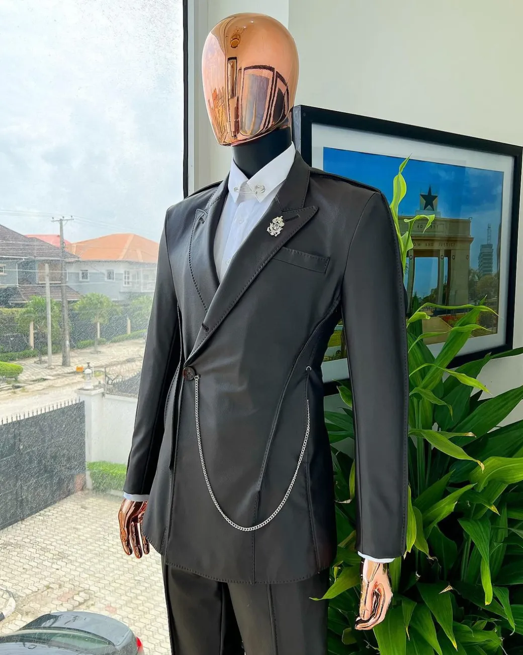 A #Herd” brown leather, knitted & outer layered peak lapel wrap suit