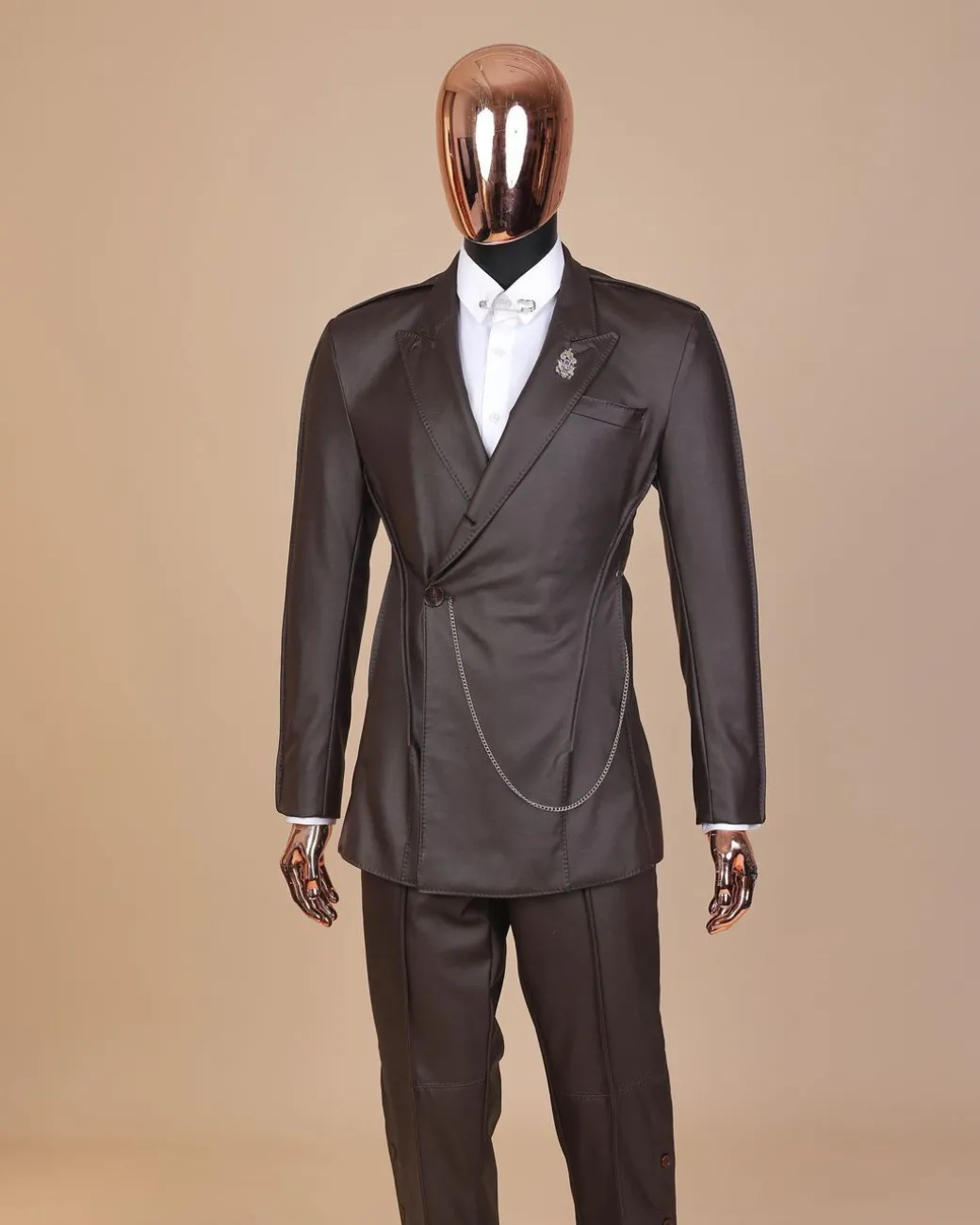 A #Herd” brown leather, knitted & outer layered peak lapel wrap suit