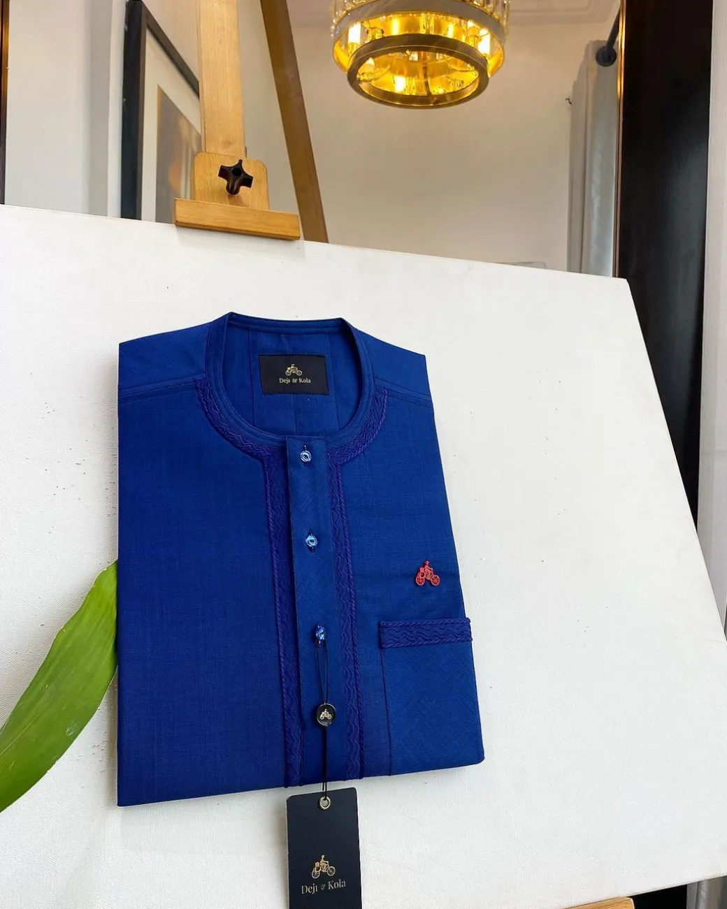 An Admiral Blue, clear view blue Swarovski buttons, edge embroidery, pocket details African traditional senator kaftan native.