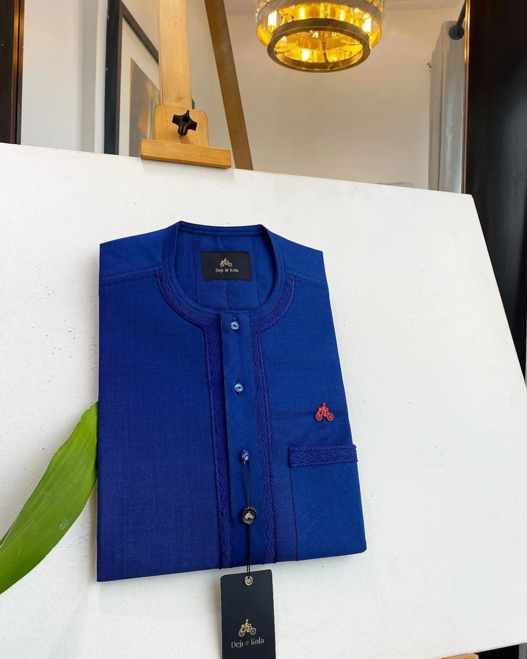 An Admiral Blue, clear view blue Swarovski buttons, edge embroidery, pocket details African traditional senator kaftan native.