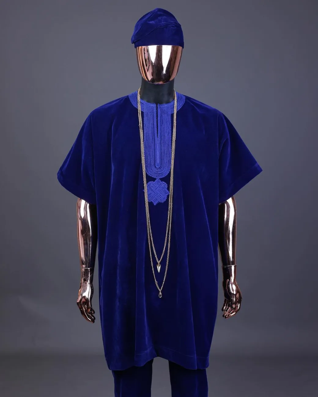 An Admiral blue daftan, sokoto & Fila Yoruba African native.