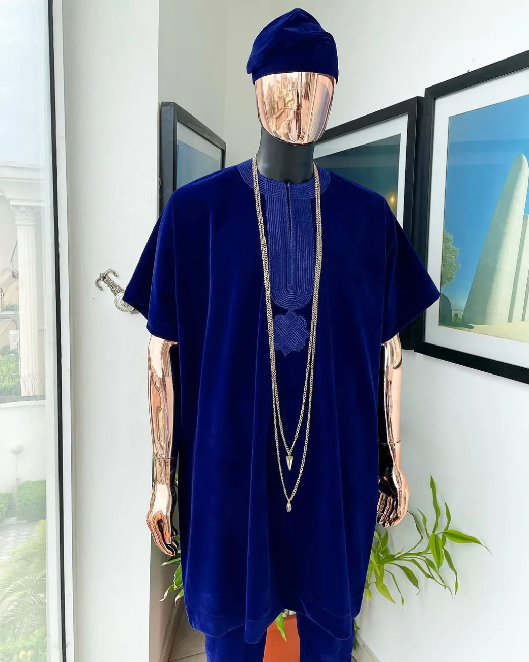 An Admiral blue daftan, sokoto & Fila Yoruba African native.