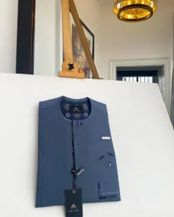 An air-force blue strap and roof pocket, single button front flap Kaftan