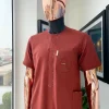 An Amber orange, paisley mountain top patch pocket detailing African traditional senator Kaftan native.