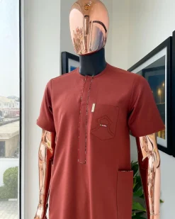 An Amber orange, paisley mountain top patch pocket detailing African traditional senator Kaftan native.