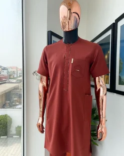 An Amber orange, paisley mountain top patch pocket detailing African traditional senator Kaftan native.
