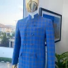 An Azure blue and apricot orange glen check “preacher” double breasted safari suit