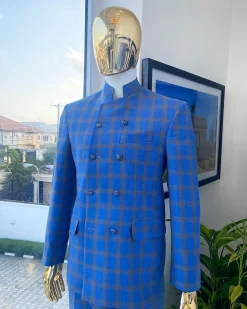 An Azure blue and apricot orange glen check “preacher” double breasted safari suit