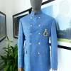An Azure blue and apricot orange glen check “preacher” double breasted safari suit