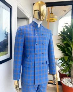 An Azure blue and apricot orange glen check “preacher” double breasted safari suit