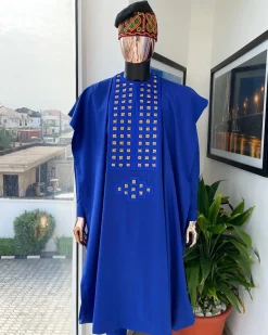 An Azure blue, connected square embroidery design with gold treading & matching Swarovski stone details agbada
