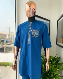 An azure blue, curly 3D embroidery flap and pocket detailing African traditional senator kaftan native