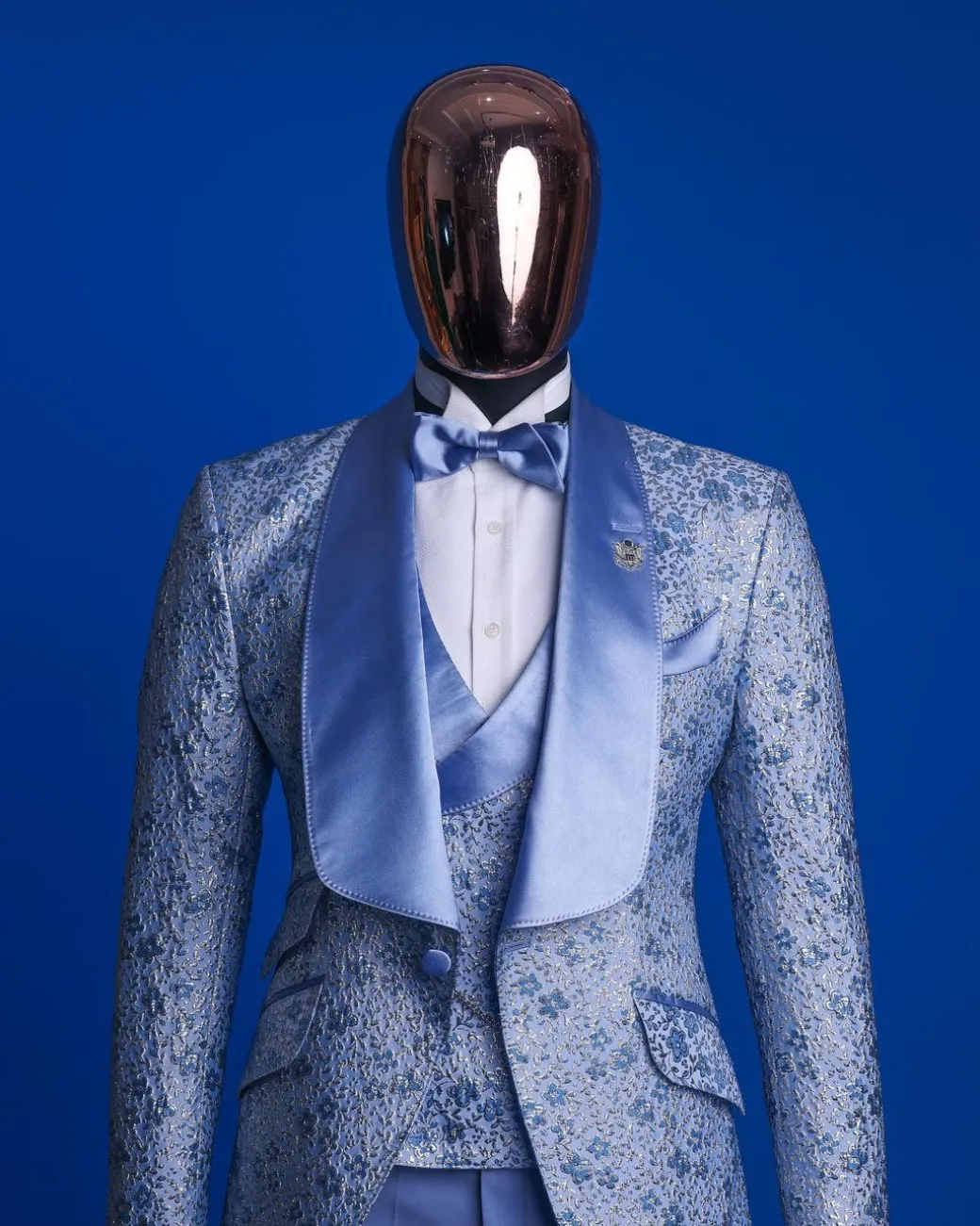 An Azure blue, knitted, star studded metallic jacquard, shawl lapel tuxedo suit.
