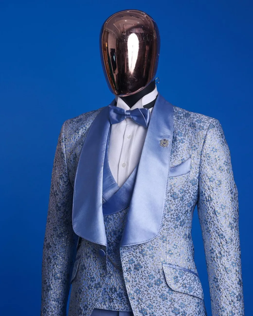 An Azure blue, knitted, star studded metallic jacquard, shawl lapel tuxedo suit.