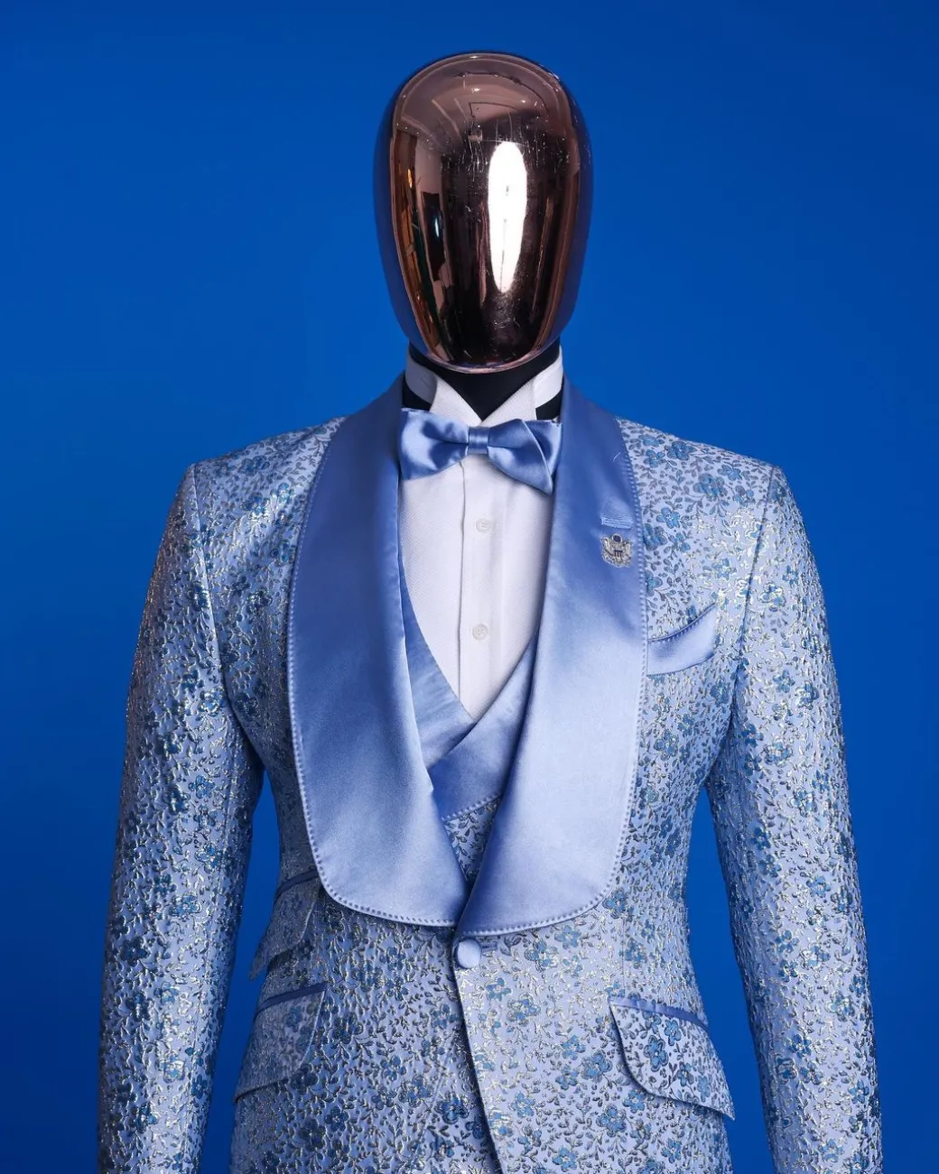 An Azure blue, knitted, star studded metallic jacquard, shawl lapel tuxedo suit.