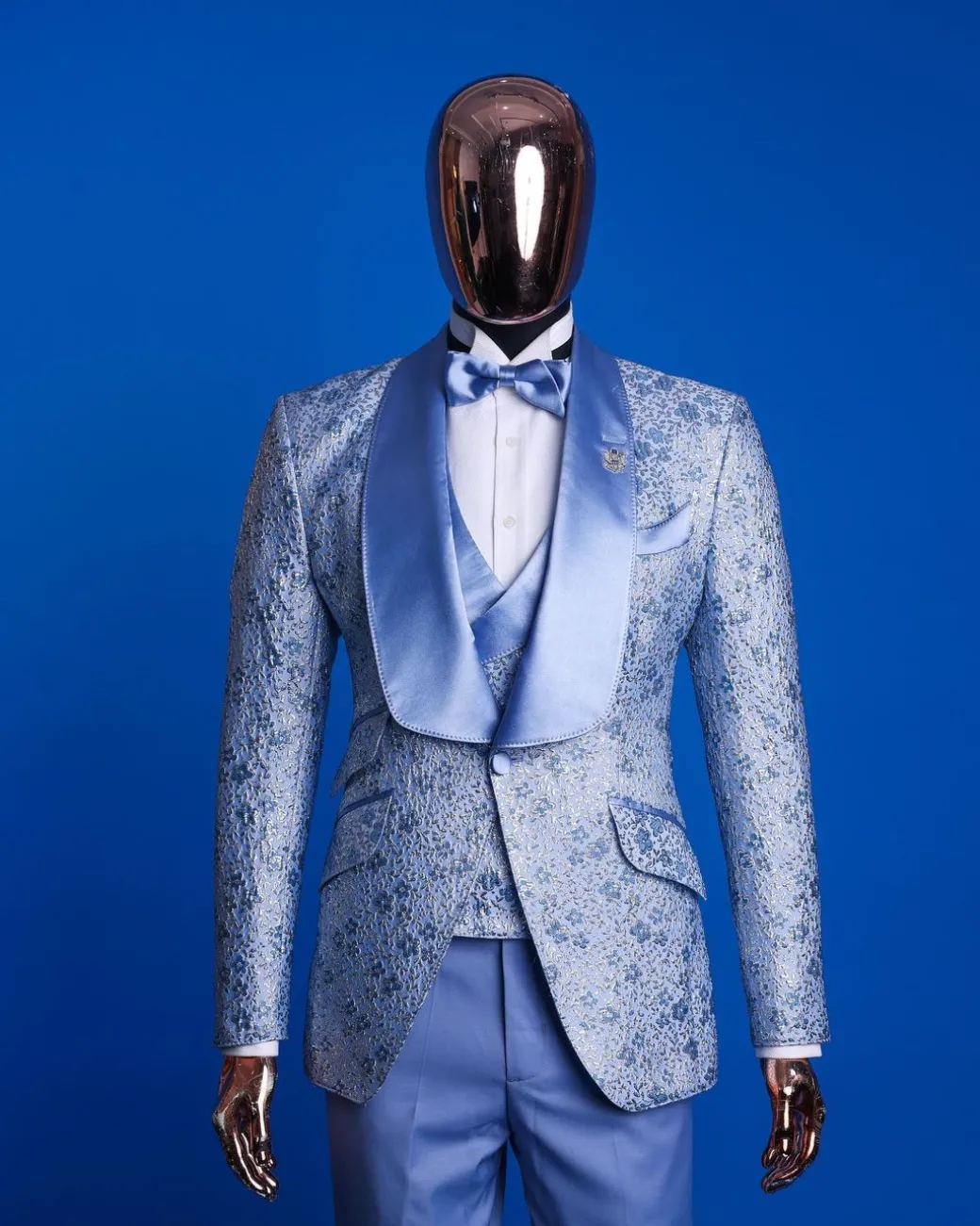 An Azure blue, knitted, star studded metallic jacquard, shawl lapel tuxedo suit.