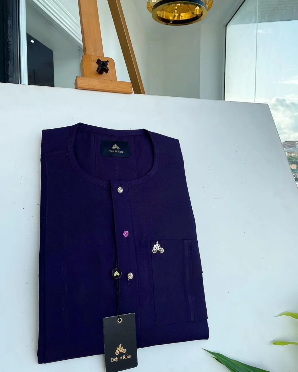 An egg plant purple, front flap and double layer patch pocket detailing senator kaftan native.