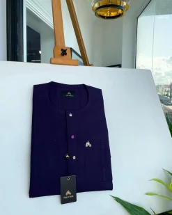 An egg plant purple, front flap and double layer patch pocket detailing senator kaftan native.