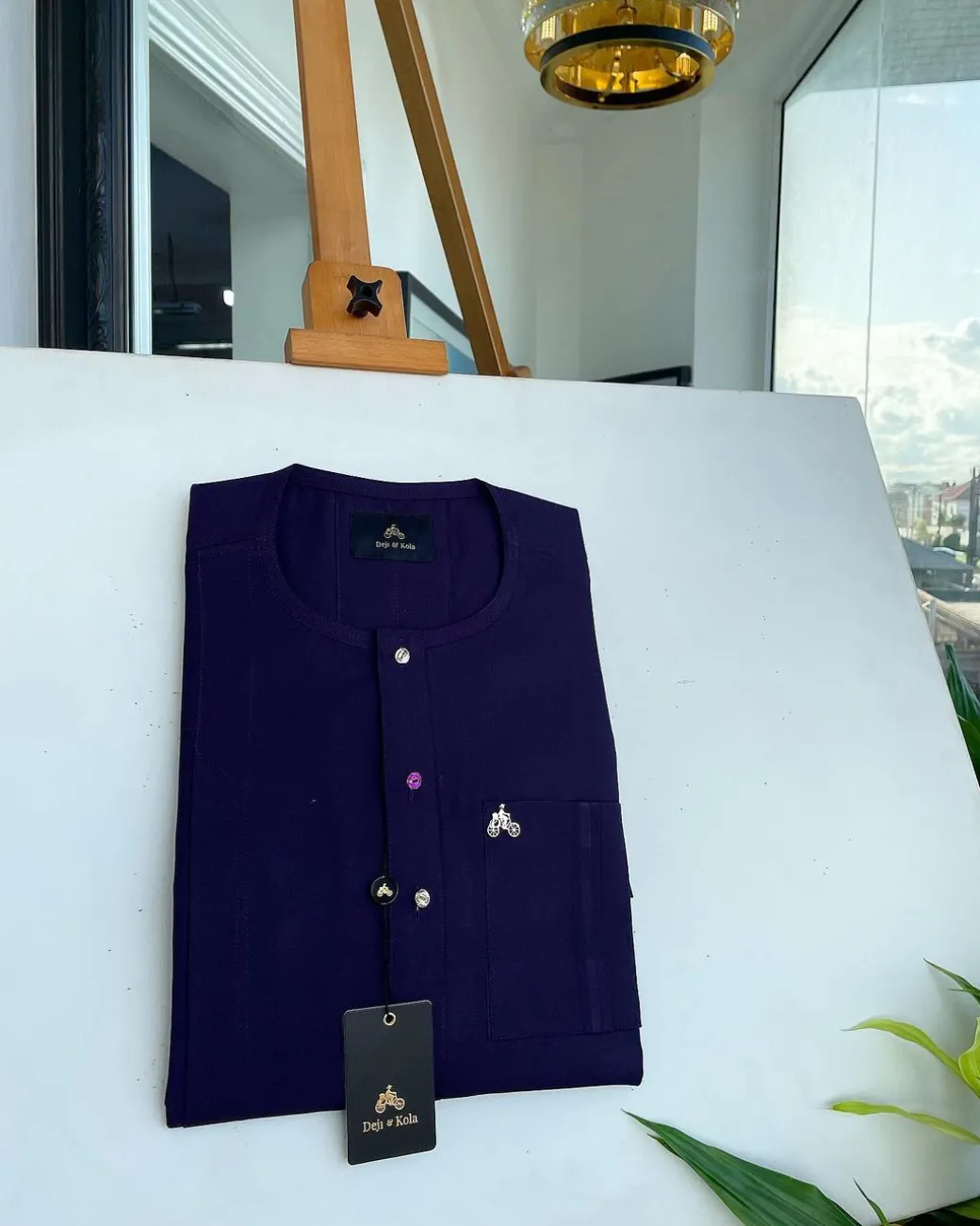 An egg plant purple, front flap and double layer patch pocket detailing senator kaftan native.