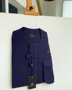 An Eggplant purple, combat front flap and pocket with a black Swarovski button detailing African traditional senator kaftan native.