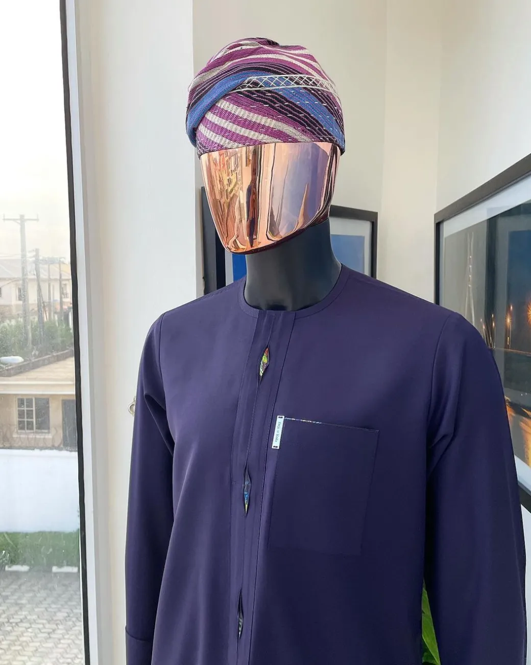 An eggplant purple flap with paisley lining details, African traditional senator kaftan native