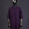 An eggplant purple front flap with matching Swarovski button detailing kaftan and Sokoto