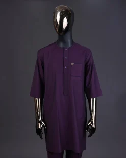 An eggplant purple front flap with matching Swarovski button detailing kaftan and Sokoto