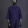 An eggplant purple, front flap with black Swarovski button, square and anchor embroidery detailing kaftan and Sokoto