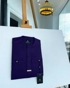 An eggplant purple, front flap and a 2 combat pocket African traditional senator kaftan native.