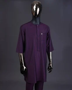 An eggplant purple front flap with matching Swarovski button detailing kaftan and Sokoto