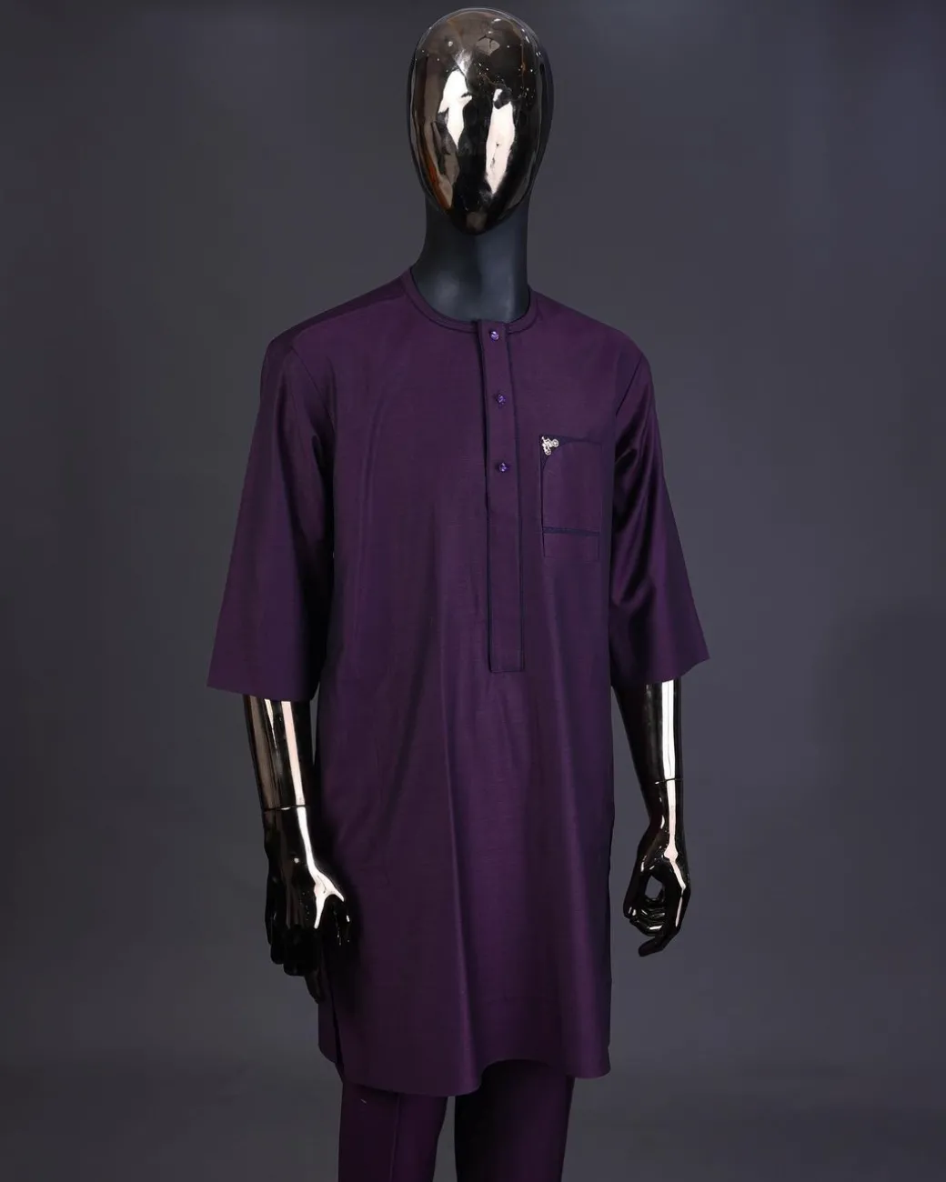 An eggplant purple front flap with matching Swarovski button detailing kaftan and Sokoto