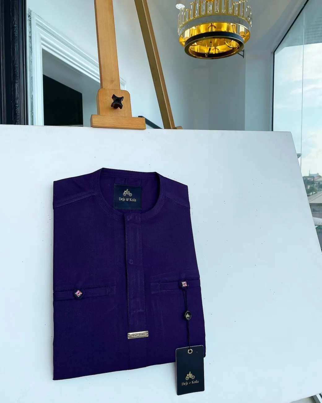 An eggplant purple, front flap and a 2 combat pocket African traditional senator kaftan native.