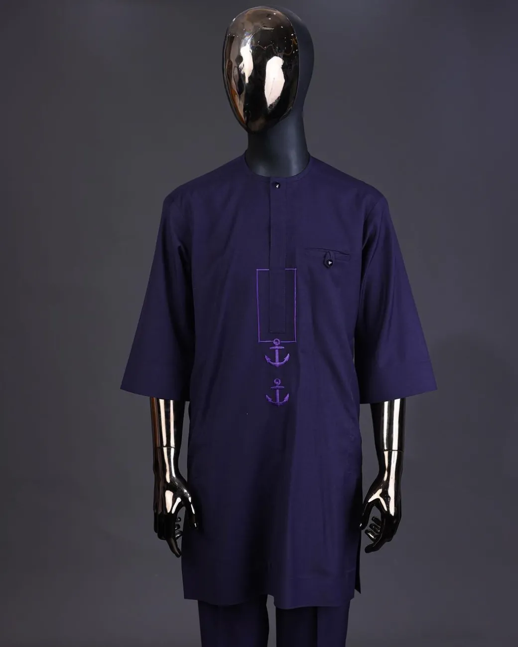 An eggplant purple, front flap with black Swarovski button, square and anchor embroidery detailing kaftan and Sokoto