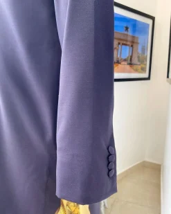 An eggplant purple “Suktan” shoulder drop embroidery and front flap, free suit hand sleeve details, African traditional senator native