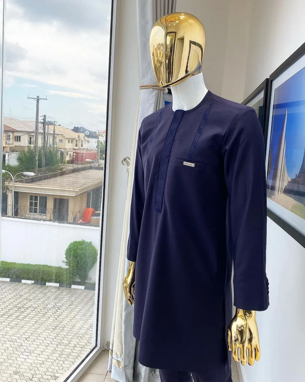 An eggplant purple “Suktan” shoulder drop embroidery and front flap, free suit hand sleeve details, African traditional senator native
