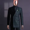 An Emerald green & black “rival” 1/4 cut ocean element peak lapel double breasted jacquard suit