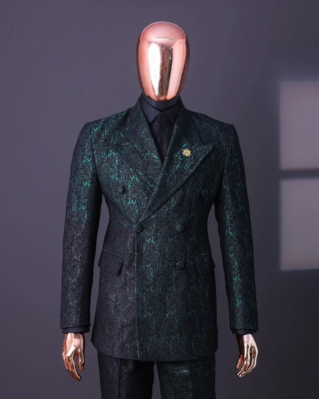 An Emerald green & black “rival” 1/4 cut ocean element peak lapel double breasted jacquard suit.