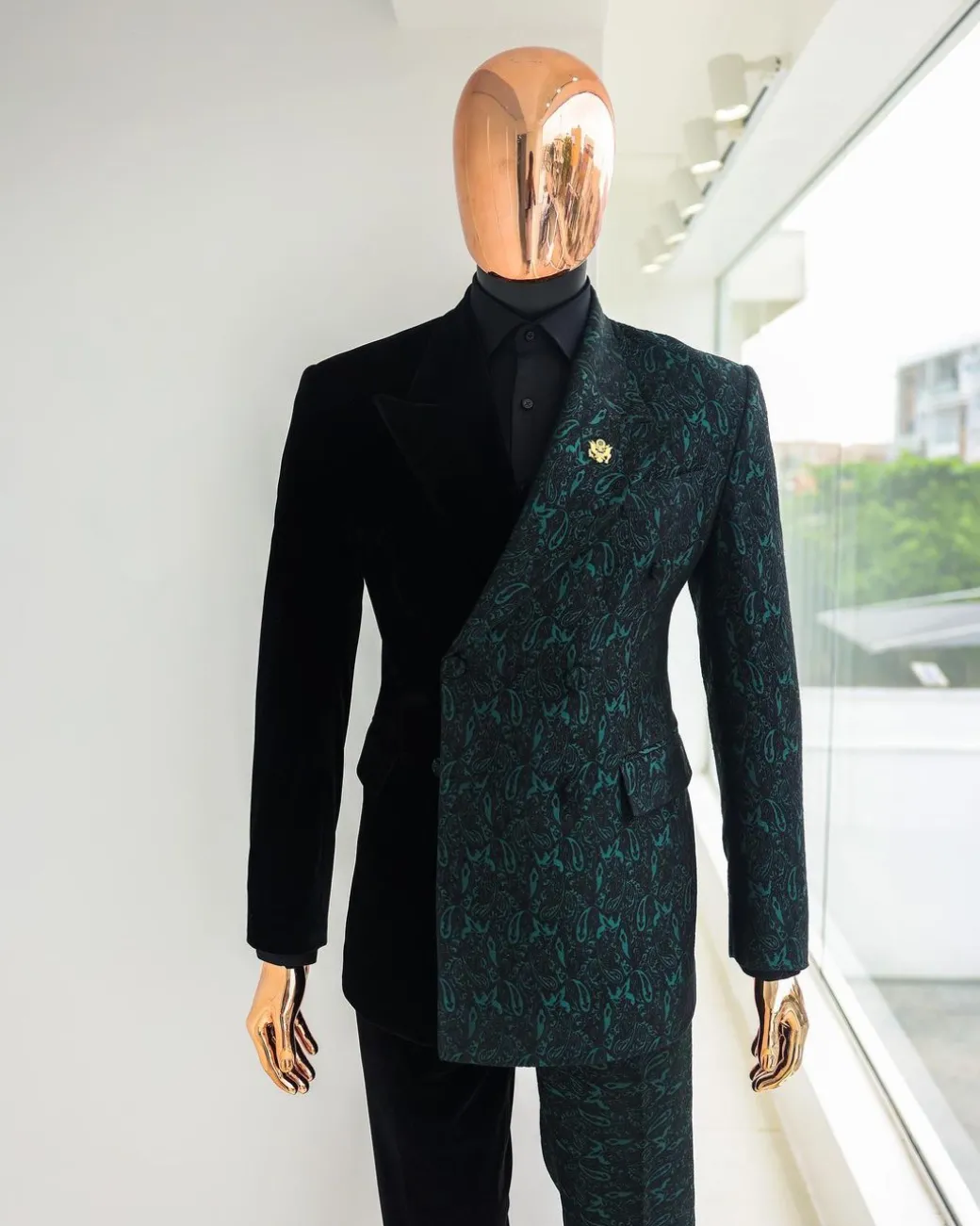 An Emerald green & black “rival” 1/4 cut ocean element peak lapel double breasted jacquard suit