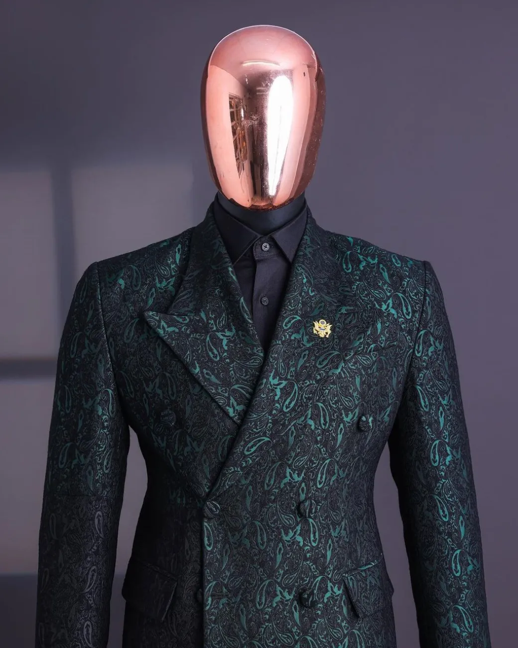An Emerald green & black “rival” 1/4 cut ocean element peak lapel double breasted jacquard suit.
