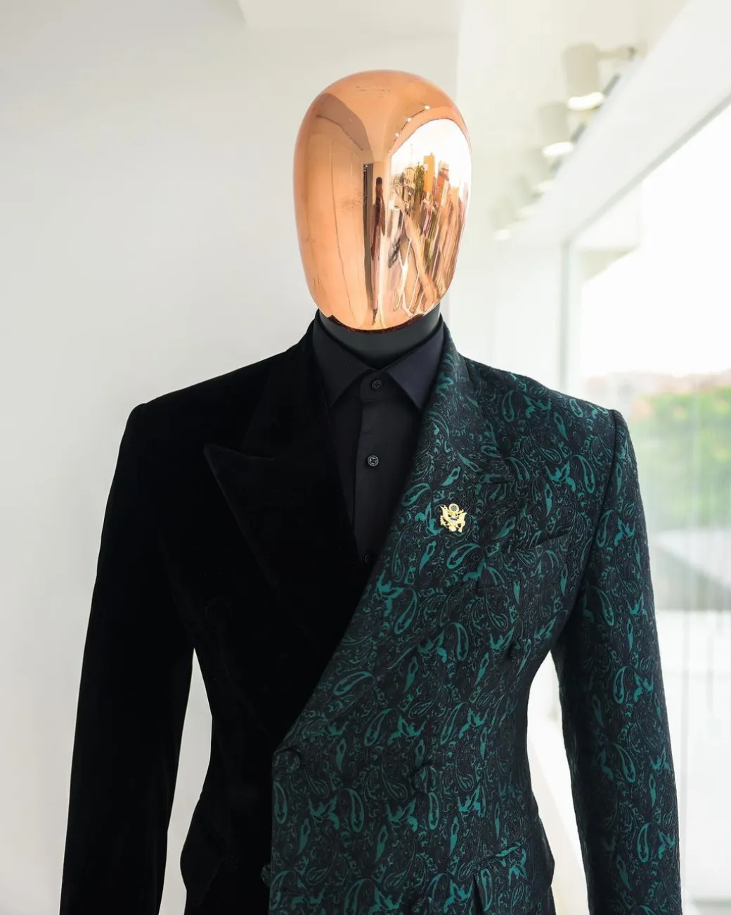 An Emerald green & black “rival” 1/4 cut ocean element peak lapel double breasted jacquard suit